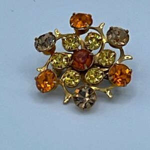 Vintage yellow, peach amber cut glass crystal brooch.